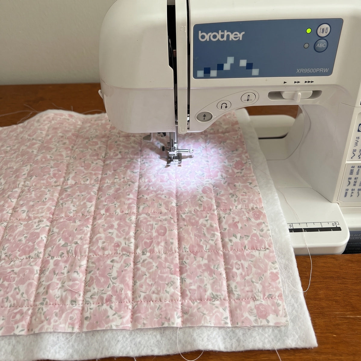 Juliette being quilted by hand on the sewing machine